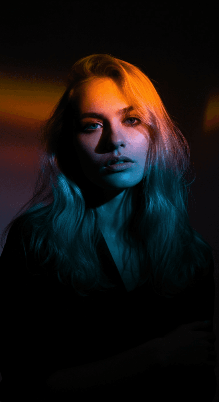 dark-lit female staring forward with multi-color light streaks across her face
